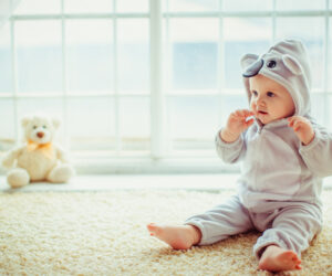 beautiful-little-boy-sitting-by-the-window