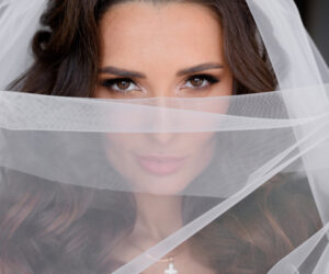 portrait-of-attractive-brunette-bride-s-look-through-the-veil